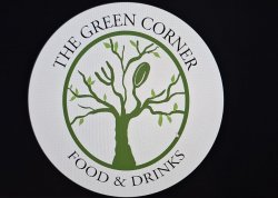 The green corner logo