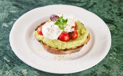 Toast with avocado, poached eggs and  Cherry Tomatoes image