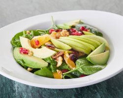 Veggies salad with spinach, cranberry, nuts, avocado and a fabulous sweet and sour dressing image