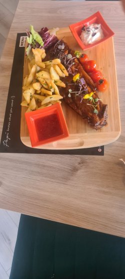 Coaste de porc cu sos bbq și cartofi steak house image