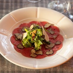 Beef Carpaccio with Truffles, Parmesan, Rucola and Nuts    image