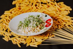 Tagliatelle con stracetti e rucola image