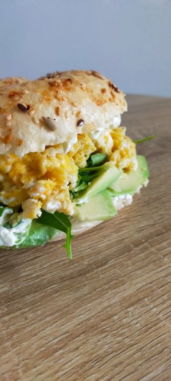 Avocado and scrambled egg bagel image