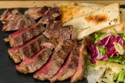 Tagliata din mușchi de vită la grătar cu dresing/Grilled beef Tagliata tenderloin with Balsamic dressing and coloured salad image