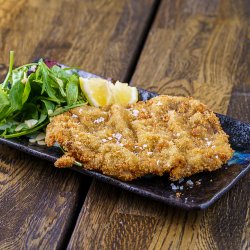 Imperial breaded beef schnitzle with fried potatoes image